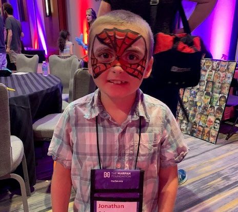 Young boy with vEDS with face painted like spiderman