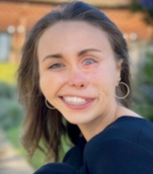 Close-up portrait of Bella Welch smiling.